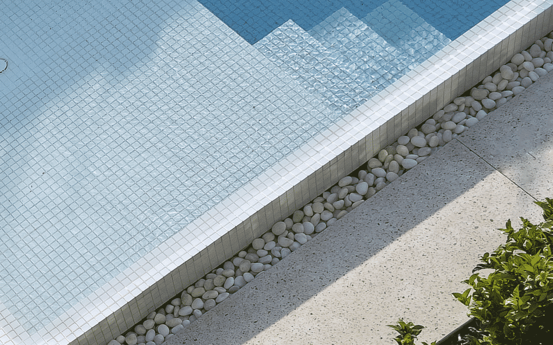 A tiled pool with stone pebbles