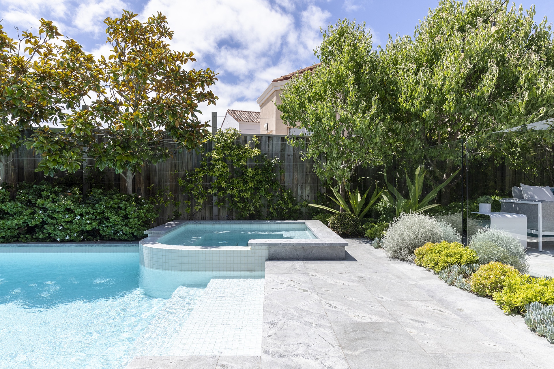 A concrete pool and spa.